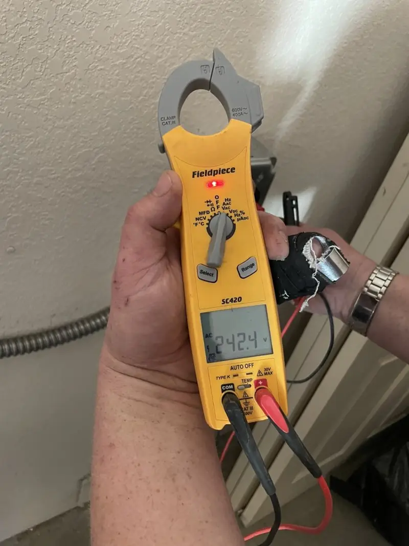 Voltage testing with clamp meter during Ceiling Fan Installation in Colerain